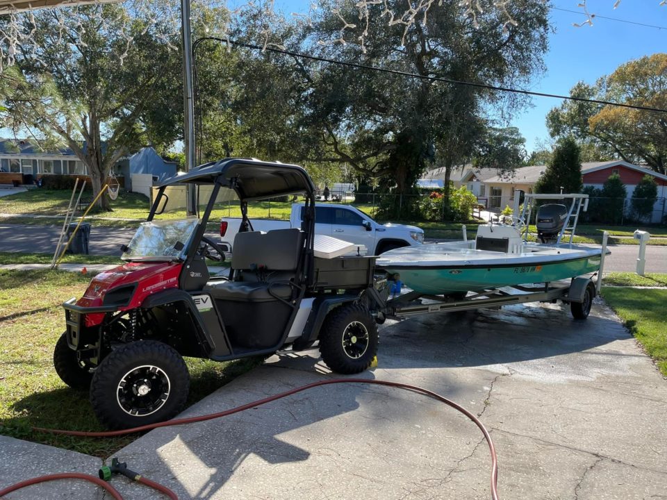 Landmaster UTV with boat on trailer